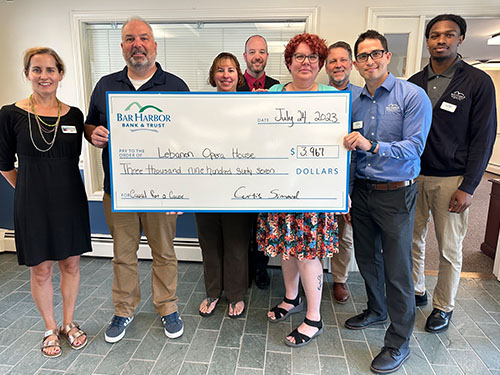 BHBT employees present a donation to Lebanon Opera House