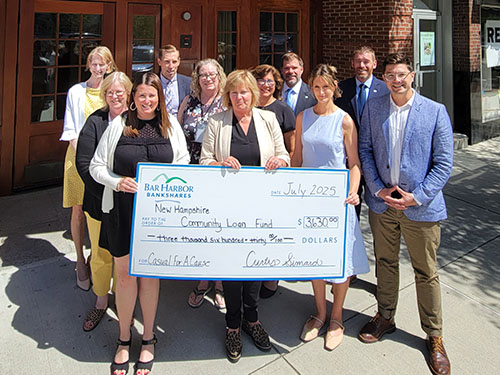 BHBT employees present a donation to New Hampshire Community Loan Fund