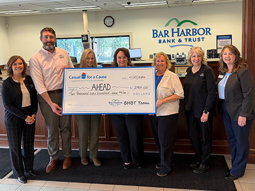 BHBT employees present a donation to AHEAD