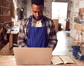 Business owner working on a laptop