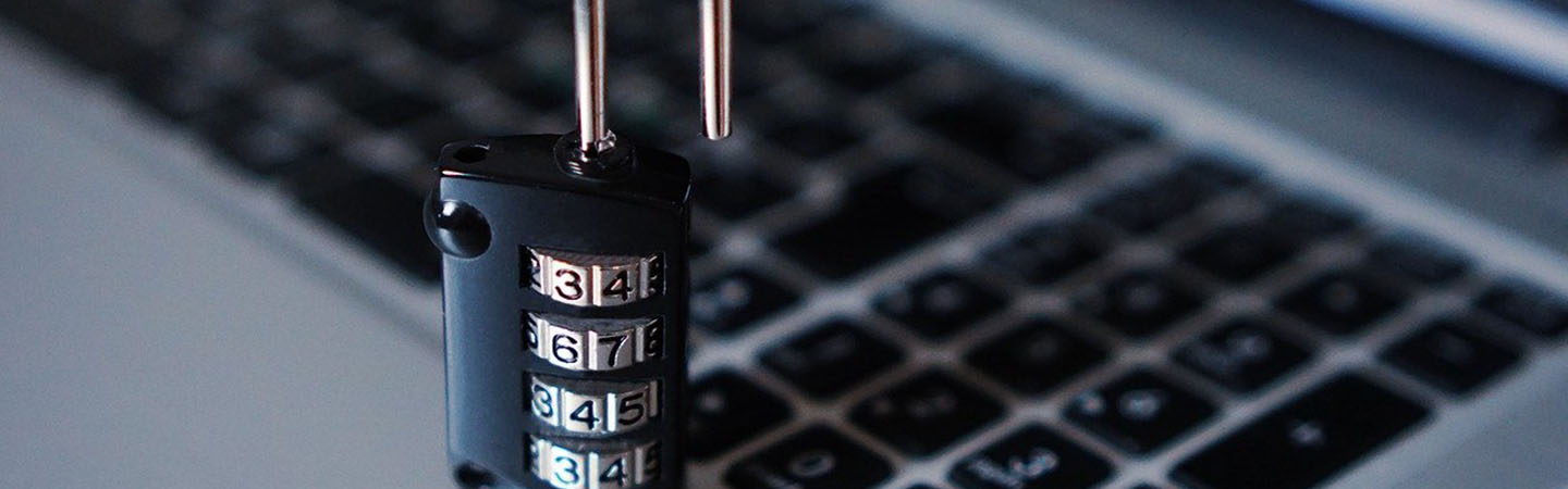 A lock sitting on a computer keyboard