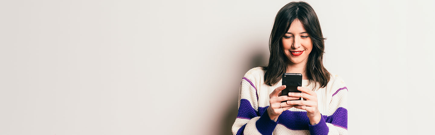 Young girl looking at a smartphone
