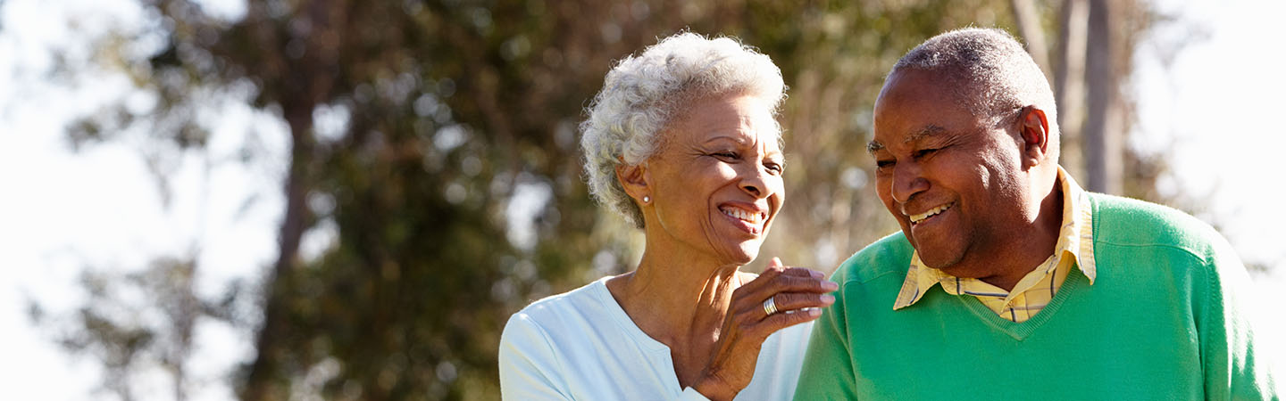 Older couple smiling at each other