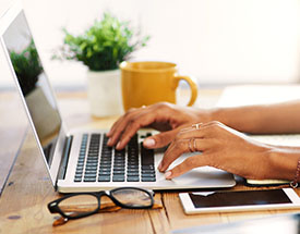 Woman typing on laptop