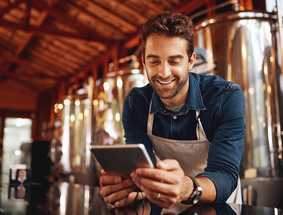 A businessman holding a tablet.