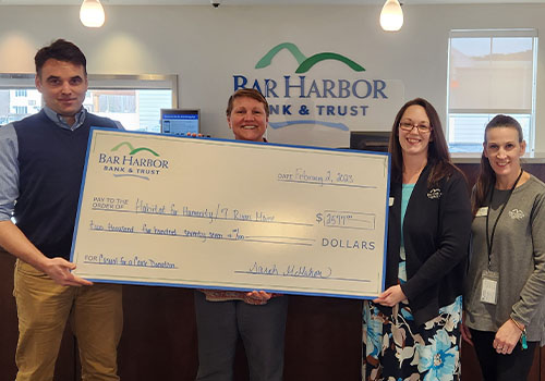 BHBT employees present a donaton to Habitat for Humanity/7 Rivers Maine