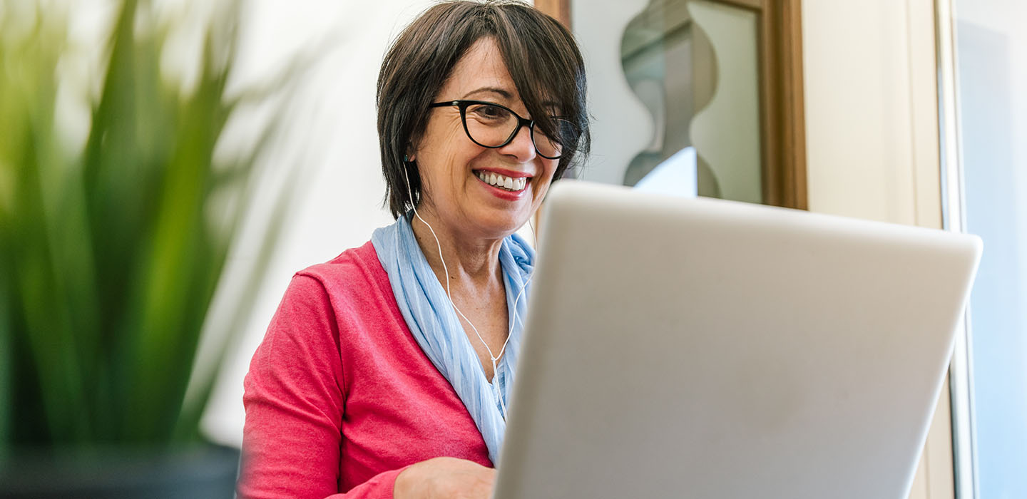 Woman watching videos on a laptop