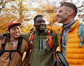 Three men hiking in the woods