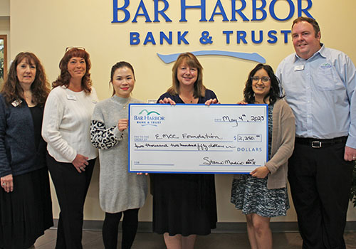 BHBT employees present a donation to Eastern Maine Community College Foundation