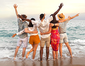 Image of friends celebrating on a beach