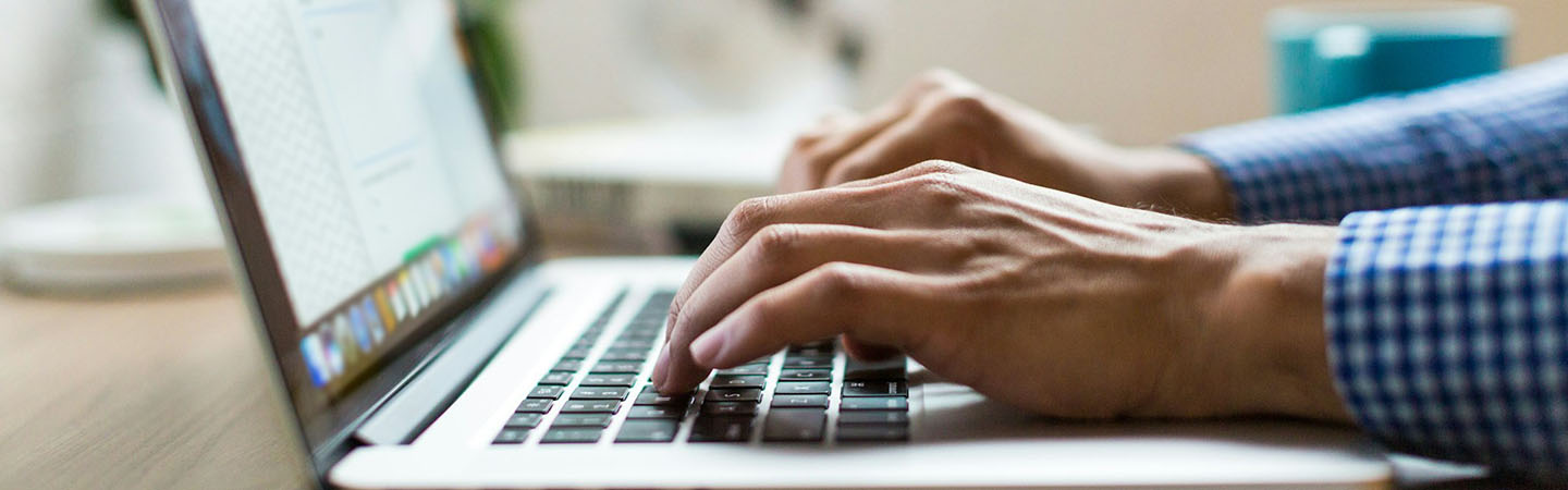 Person typing on a laptop