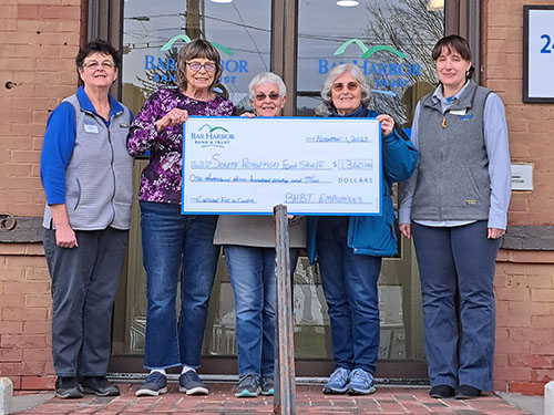 BHBT employees present a donation to South Royalton Area Food Shelf