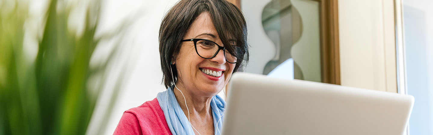 Woman watching videos on a laptop