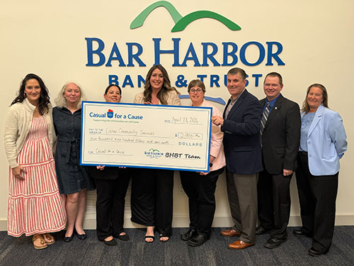 BHBT employees present a donation to LISTEN Community Services