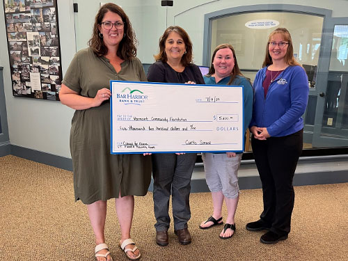 BHBT employees present a donation to Vermont Community Foundation
