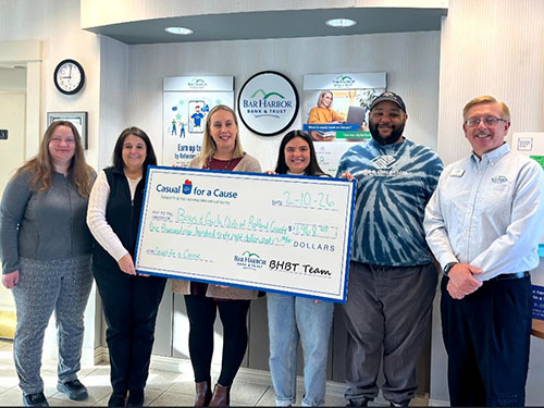 BHBT employees present a donation to Boys and Girls Club Rutland County
