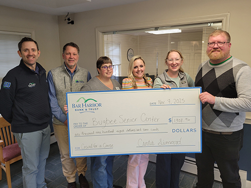 BHBT employees make a donation to Bugbee Senior Center