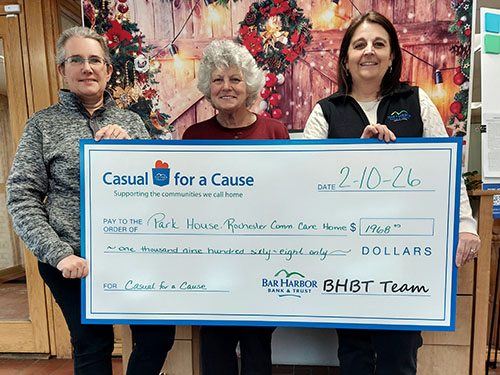 BHBT employees present a donation to Park House