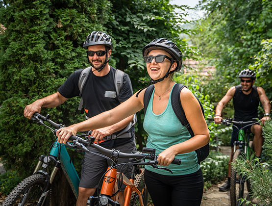 Friends biking in a wooded area