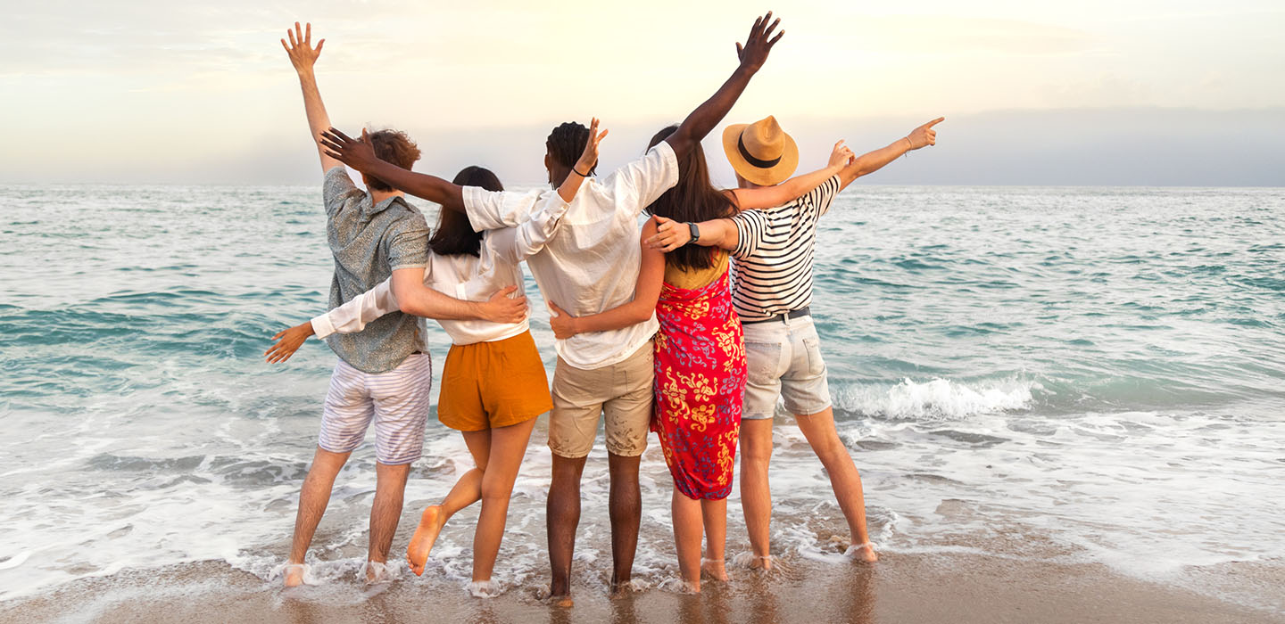 Image of friends celebrating on a beach
