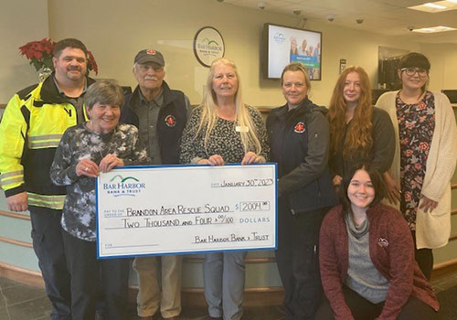 BHBT employees present a donation to Brandon Area Rescue Squad