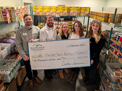 BHBT employees present a donation to Bar Harbor Food Pantry