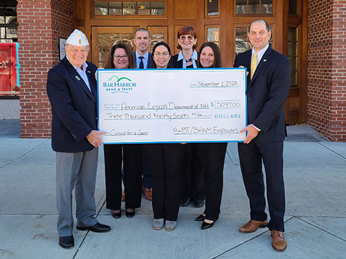 BHBT employees present a donation to American Legion Department of New Hampshire