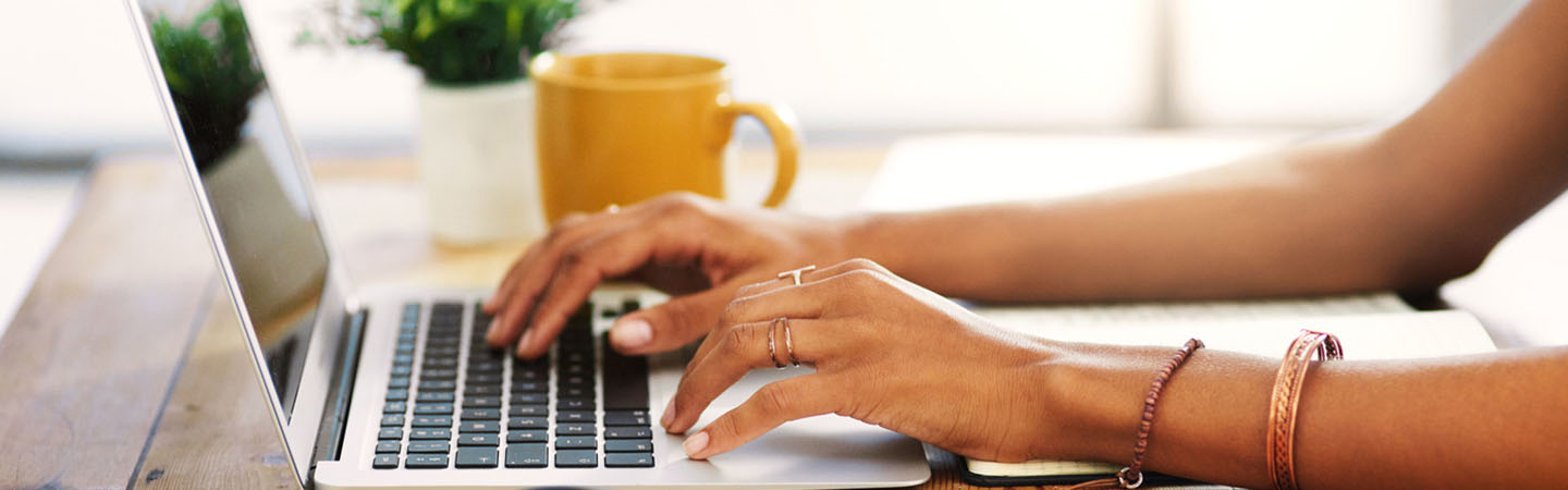 Woman typing on laptop