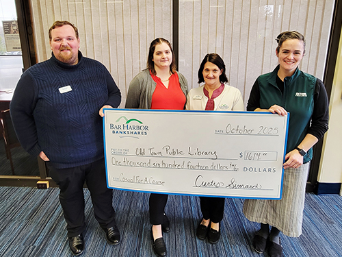 BHBT employees make a donation to Old Town Public Library