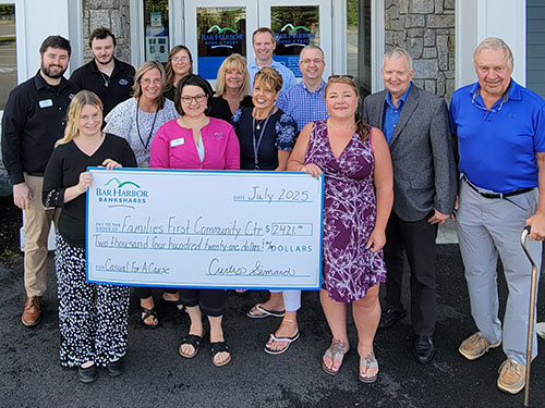BHBT employees present a donation to Families First CommunityCenter