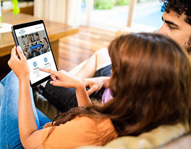 Couple looking at website on a tablet