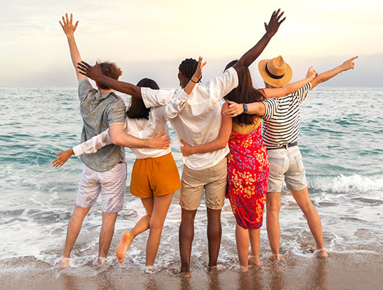 Image of friends celebrating on a beach