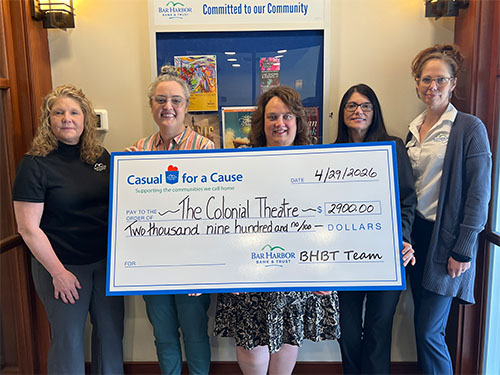 BHBT employees present a donation to The Colonial Theatre