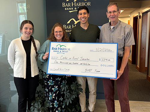 BHBT employees present a donation to Center on Rural Innovations