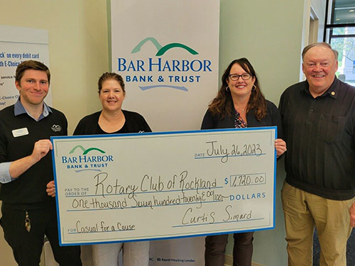 BHBT employees present a donation to Rotary Club of Rockland