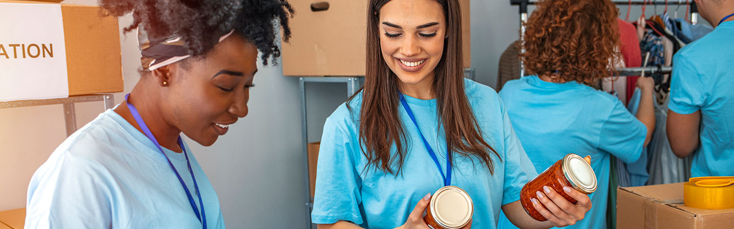 Two volunteers working at a food drive