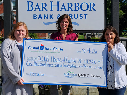 BHBT employees present a donation to OUR House of Central VT