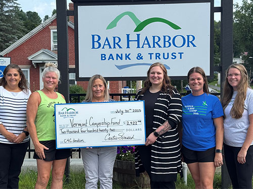 BHBT employees present a donation to Vermont Campership Fund