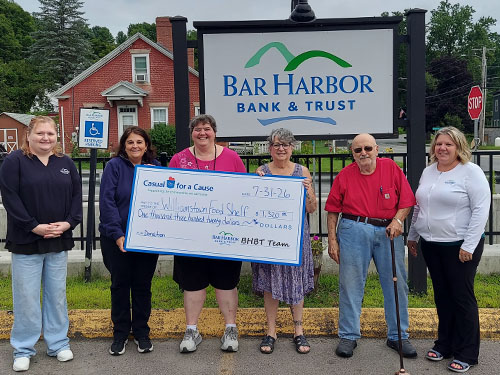 BHBT employees present a donation to Williamstown Food Shelf