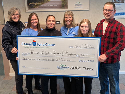 BHBT employees present a donation to Friends of Lubec Community Playground