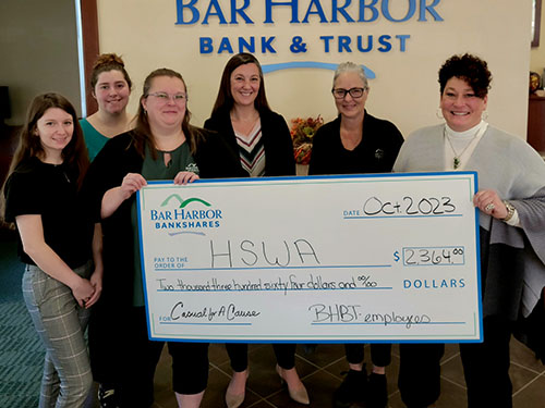 BHBT employees present a donation to Humane Society of Waterville Area