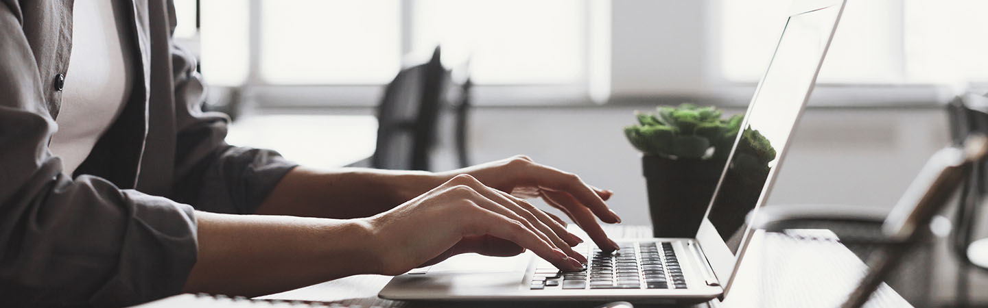 Person typing on a laptop