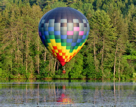 Image of a hot air balloon over water