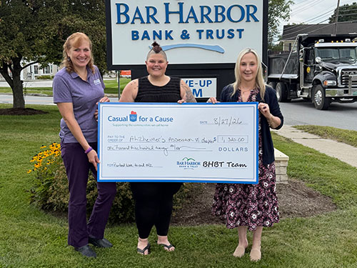 BHBT employees present a donation to Alzheimer's Association VT Chapter