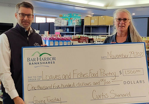 BHBT presents a donation to Loaves & Fishes Food Pantry