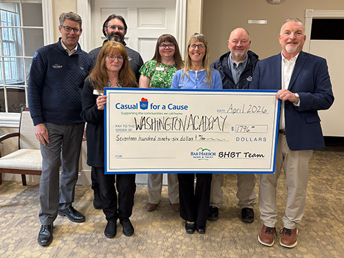 BHBT employees present a donation to Washington Academy