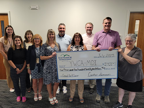 BHBT employees present a donation to YWCA MDI