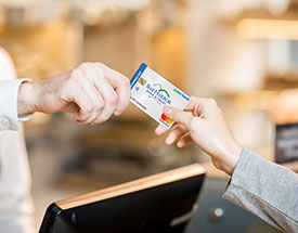 A person makes a purchase with a debit card