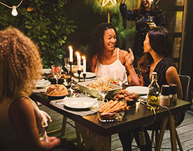 Friends enjoying dinner on a deck