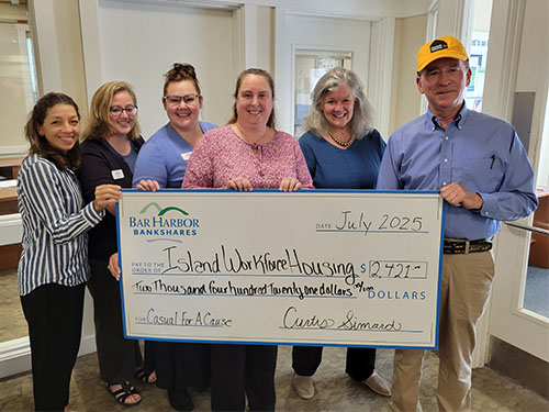 BHBT employees present a donation to Island Workforce Housing